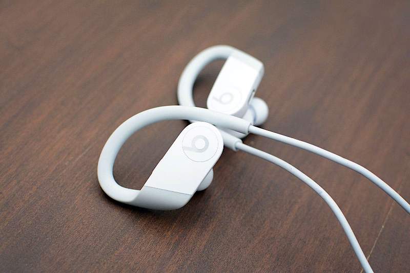 Wireless earbuds with a cable